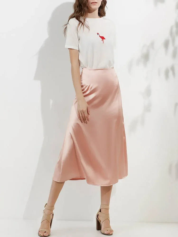 Women’s skirt with subtle patterns showcased in a studio setting.