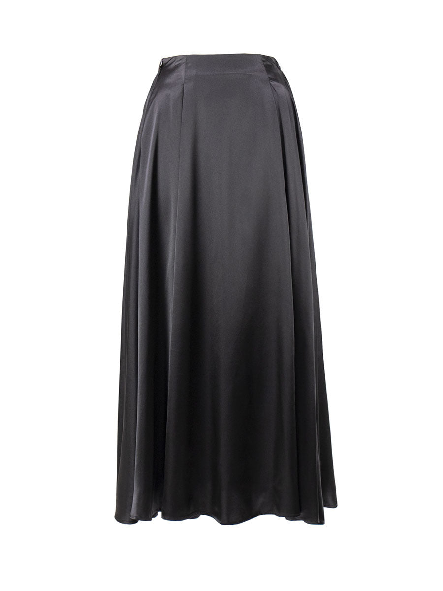 Satin skirt with a glowing finish in a cozy indoor setting.