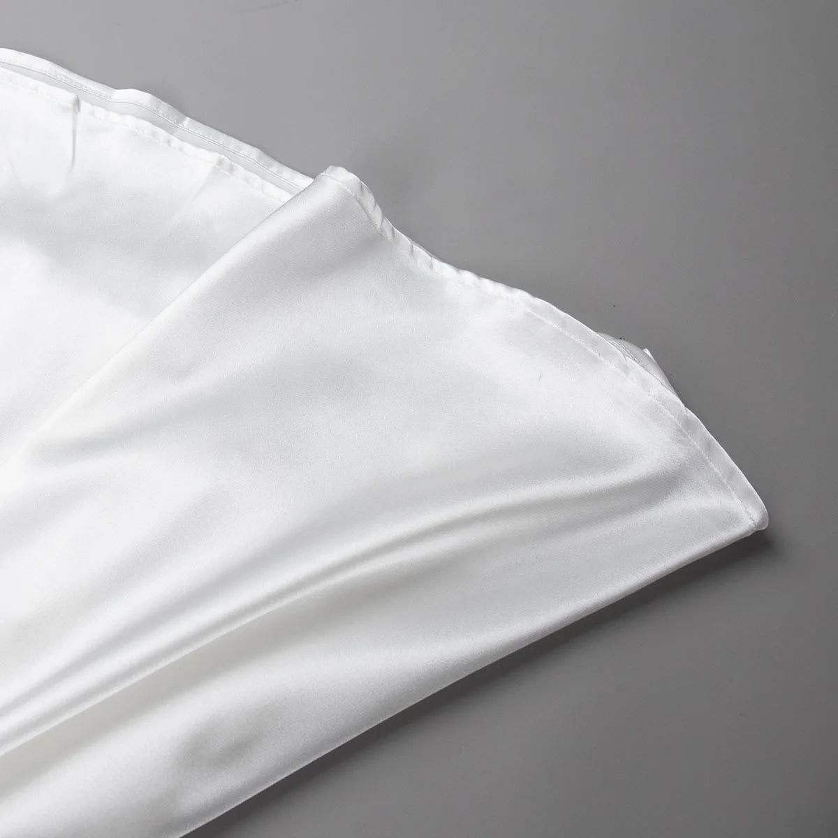 Silky ankle-length skirt laid flat on a white background.
