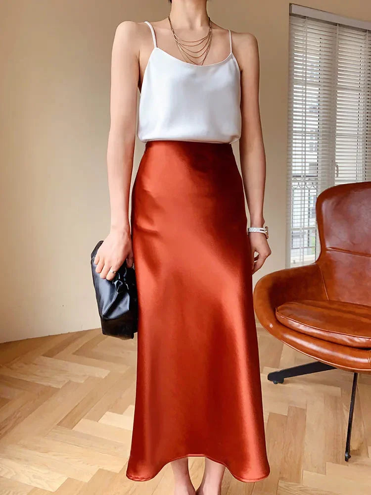 Pleated ankle-length skirt displayed on a flat surface.