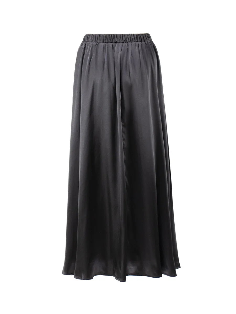 Rich-colored satin skirt photographed in soft lighting.