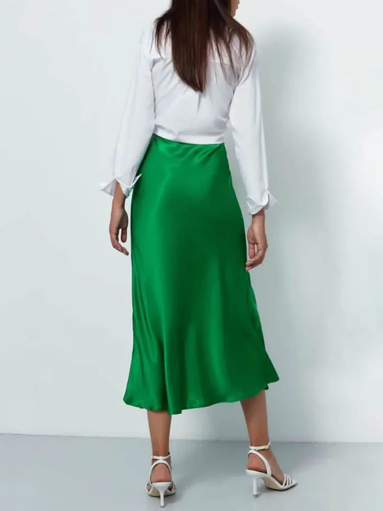 Model twirling in a flowy Korean-style skirt outdoors.