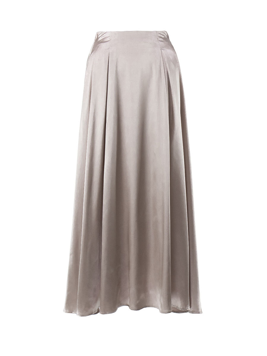 Close-up of the hemline of a satin skirt.