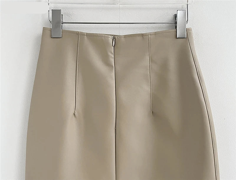 Timeless black PU leather skirt styled with a minimalist top