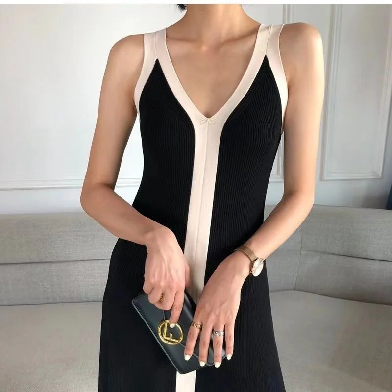 Elegant black maxi dress with sling design.