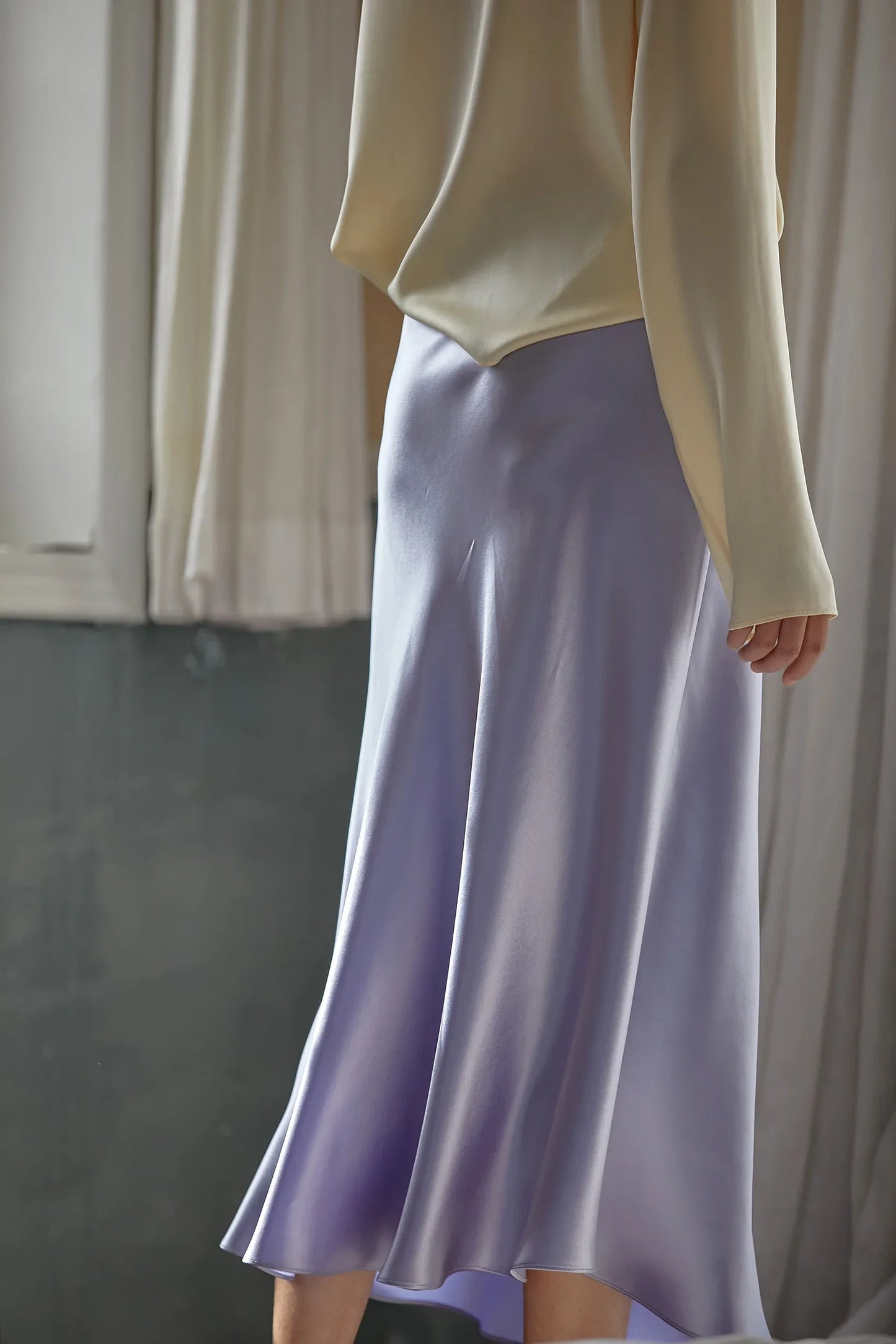 Elegant skirt in a pastel shade photographed outdoors.