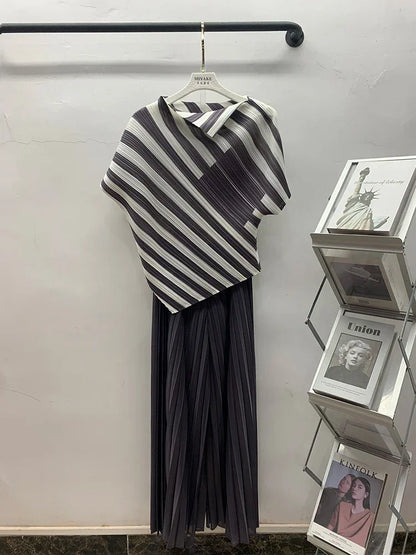 Women Contrast Color Irregular Belt Tops in black and white displayed on a hanger