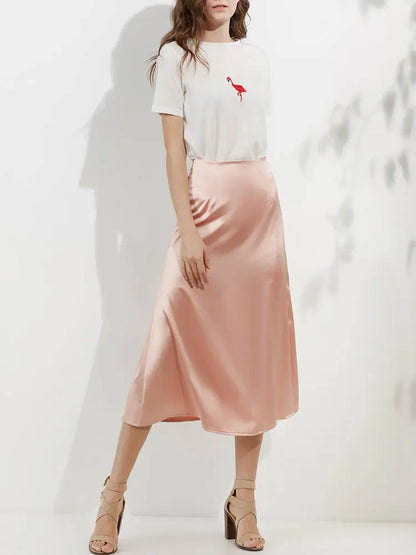 Women’s skirt with subtle patterns showcased in a studio setting.
