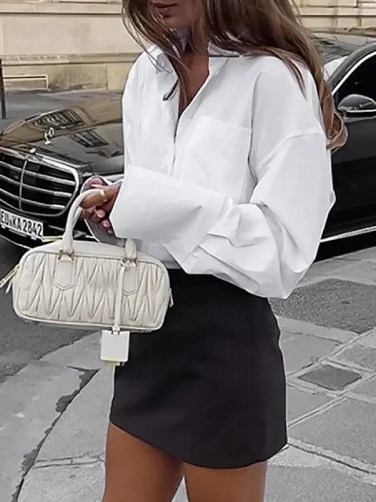 Classic white blouse for casual or formal occasions
