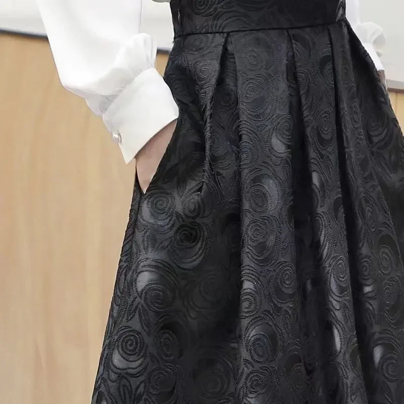 Close-up of the jacquard pattern adding sophistication to the skirt
