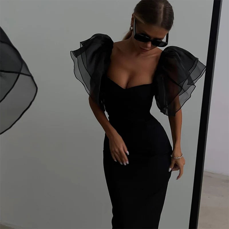 Back view of the dress highlighting the mesh butterfly sleeves
