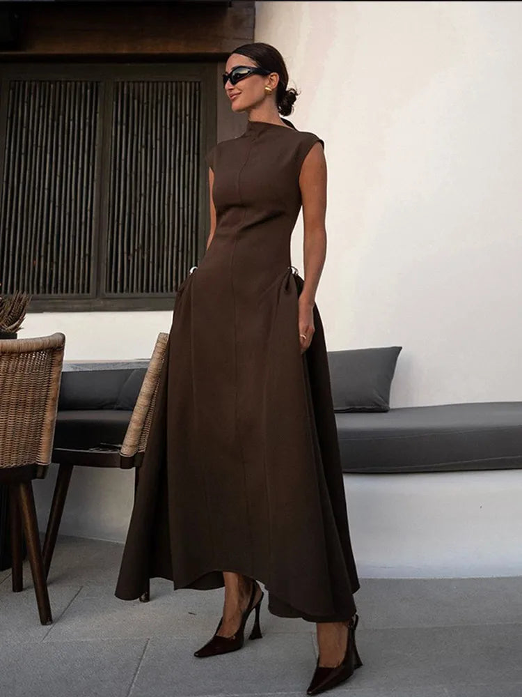 Elegant long dress with slanted collar and pleats
