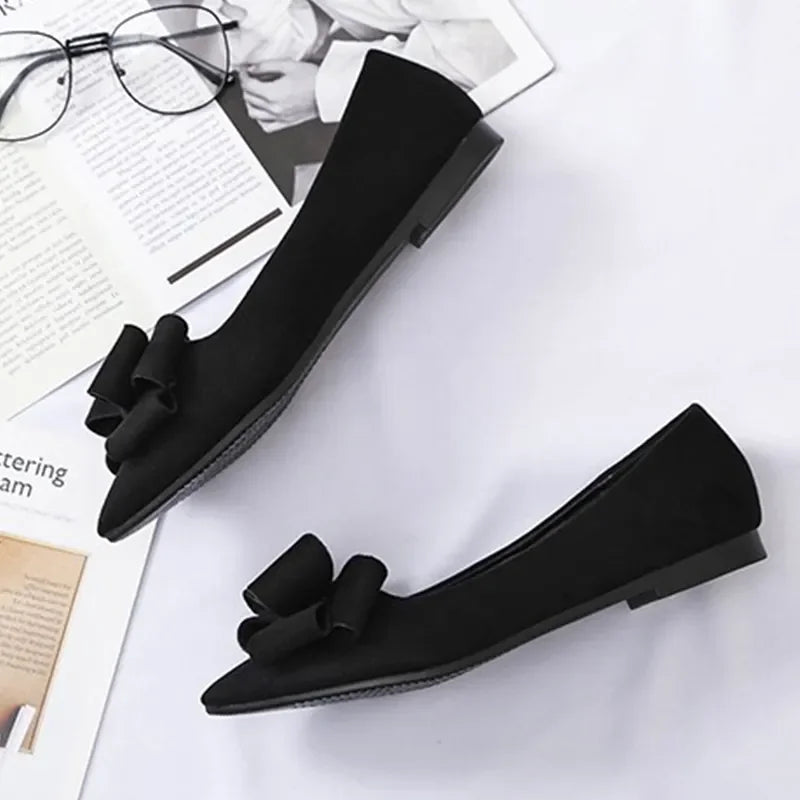 Black Bow Tie Flock Flats styled with a casual outfit.