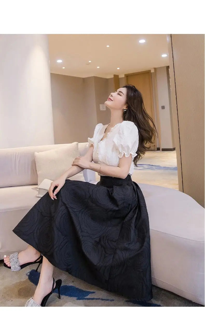 Model pairing the loose midi skirt with a casual t-shirt for a relaxed style
