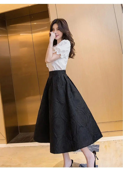 Model wearing the skirt with a belt for added waist definition
