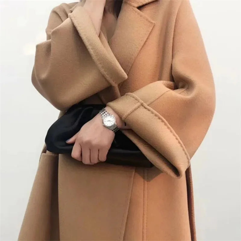 Women wearing a long loose water ripple wool coat.