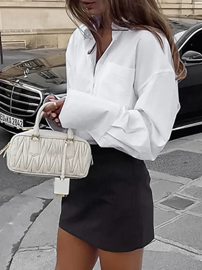 Fashion-forward white blouse for elegant office attire
