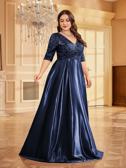 Full-length blue satin evening dress with soft sheen