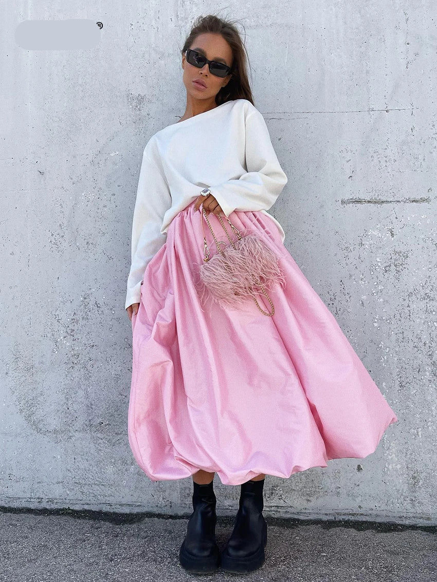 Side profile showcasing the flowing silhouette of the long skirt
