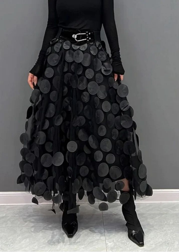 Women’s polka dot tulle mesh fabric draped on a mannequin.
