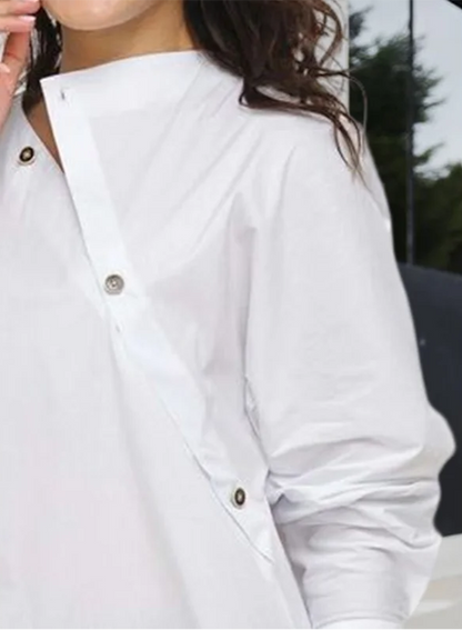 Buttoned asymmetric long sleeve top close-up
