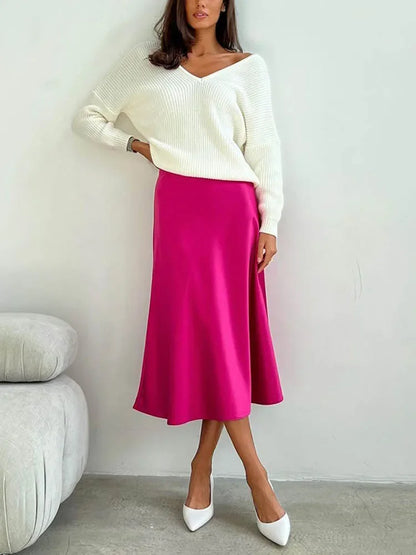 Casual yet elegant skirt styled with a long cardigan.
