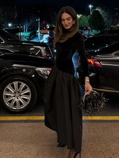 Elegant black satin maxi dress with pleated design
