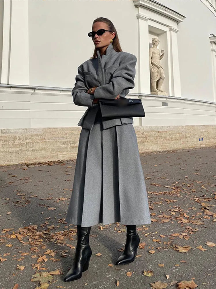 Close-up of the textured wool fabric in a long woolen skirt suit