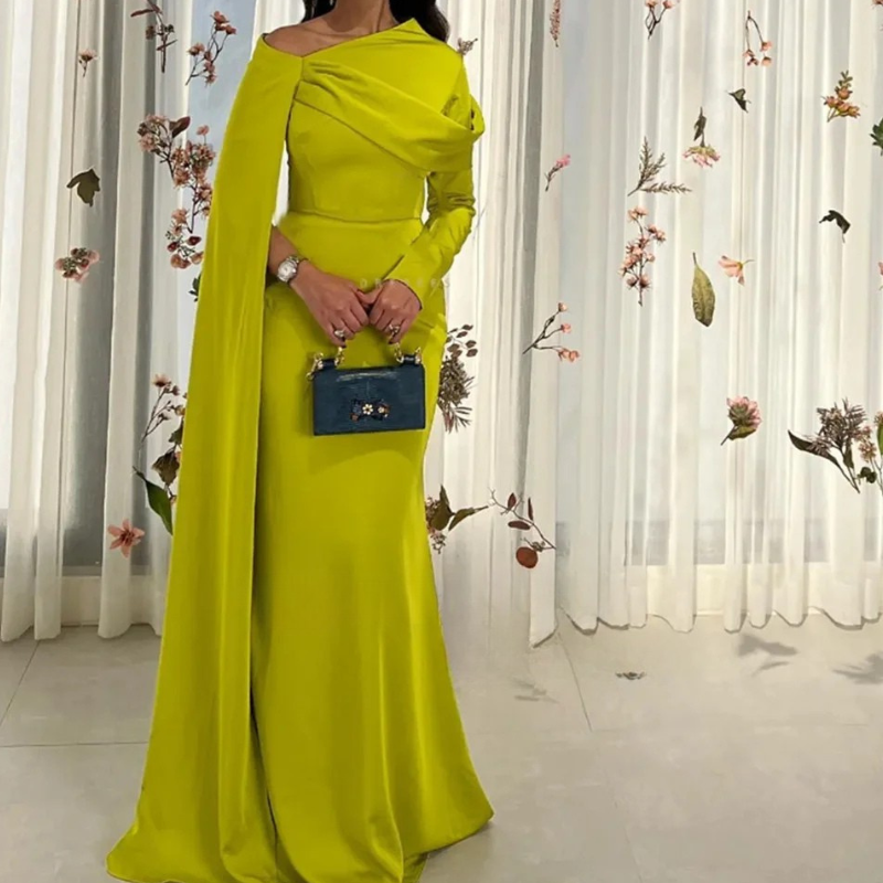 Model wearing a crepe long sleeve sheath evening gown
